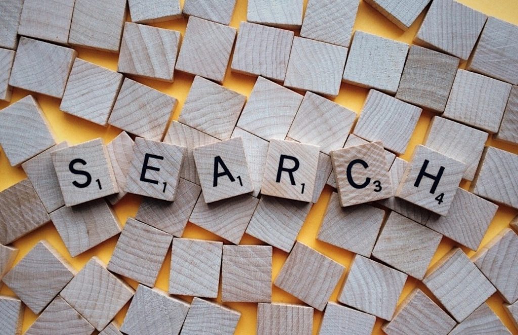 The word SEARCH on separate wood tiles