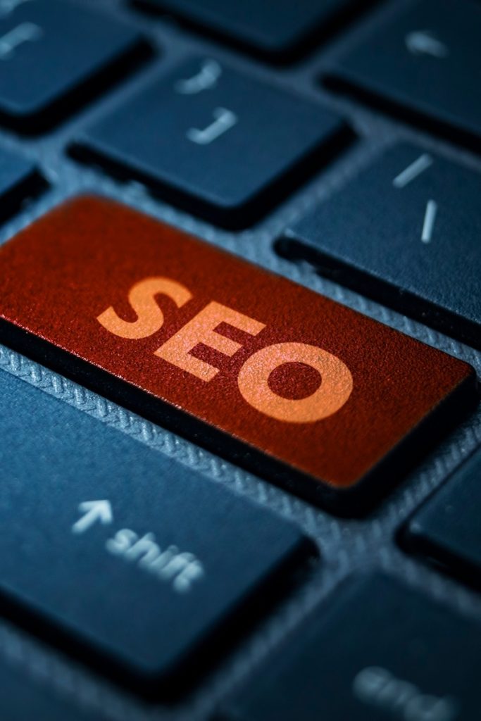 Keyboard close-up showing an orange SEO key